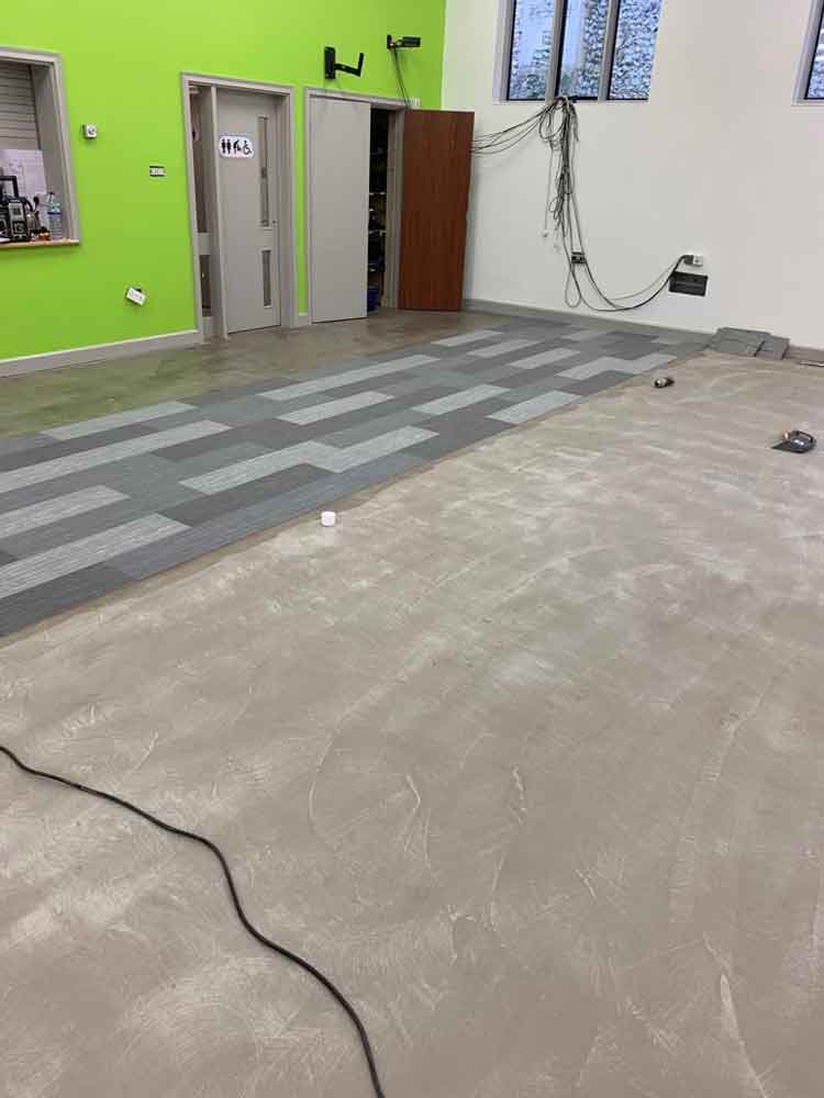 Work in progress alying Forbo carpet tiles after sub floor preparation