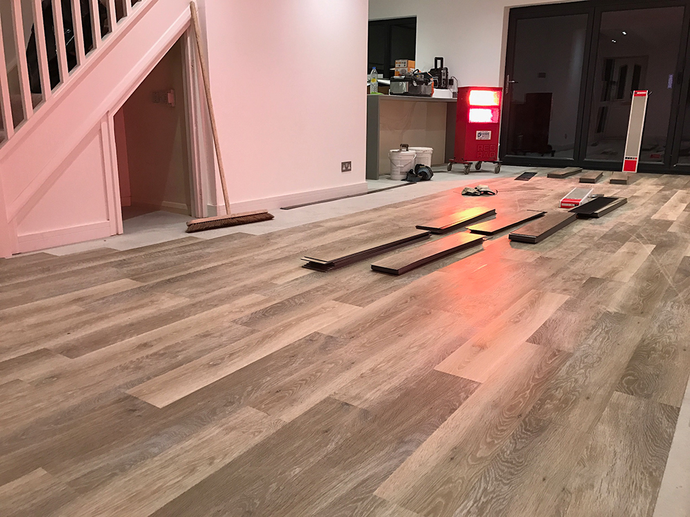 Work in progress in applying Karndean luxury vinyl flooring