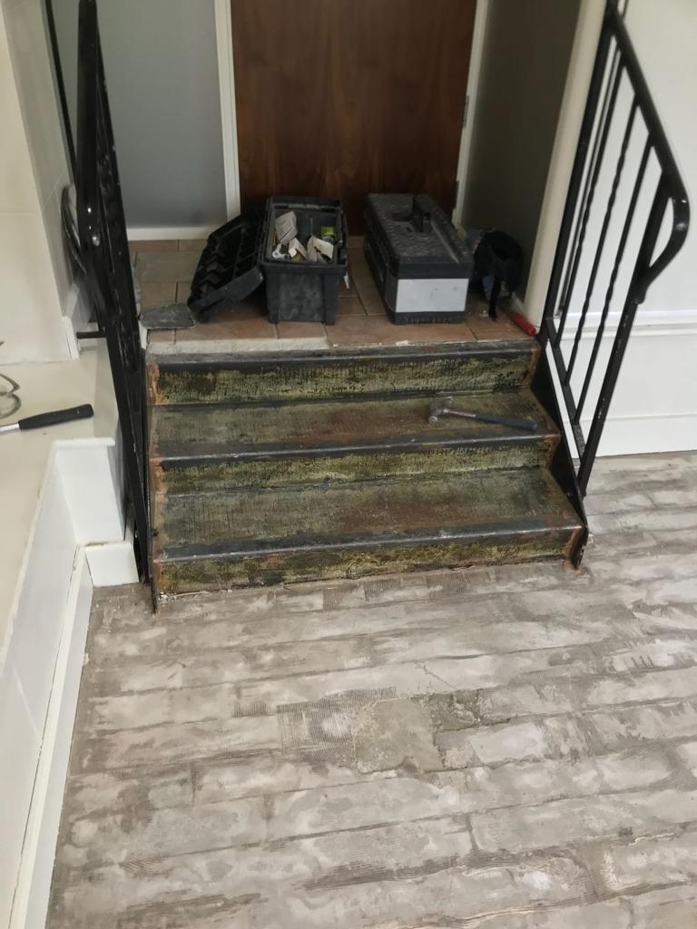 Old flooring covering removed in health club in Chertsey