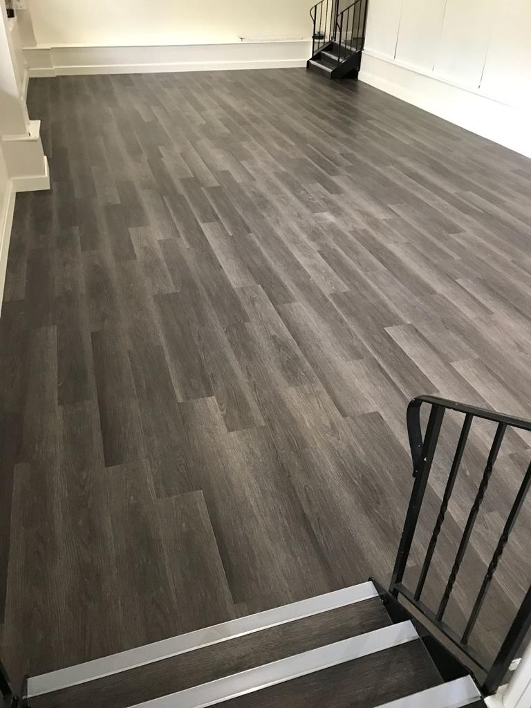 Completed installation of Polyflor Expona Commercial Wood Luxury Vinyl Tile colour Dark Limed Oak 4083 with all recommended adhesives.