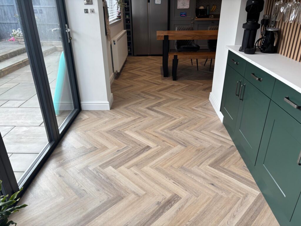 kitchen diner area with Polyflor herringbone flooring
