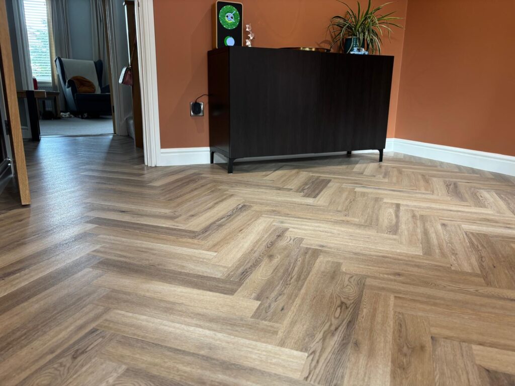 Herringbone flooring in living area