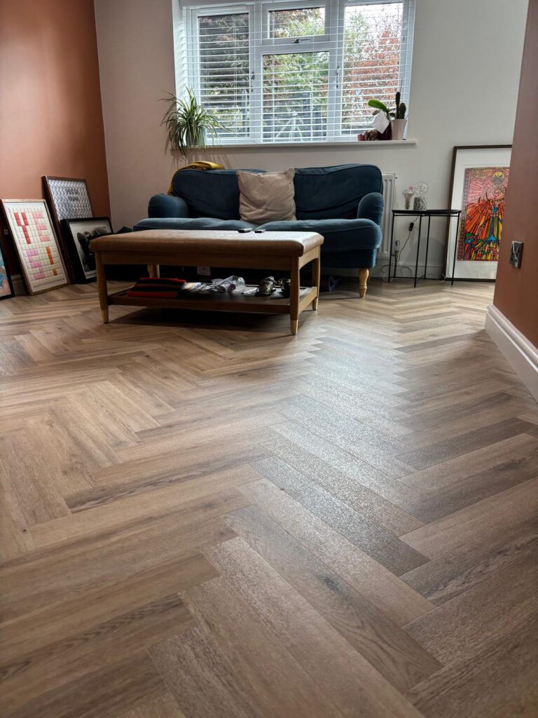 sitting area with herringbone flooring installation